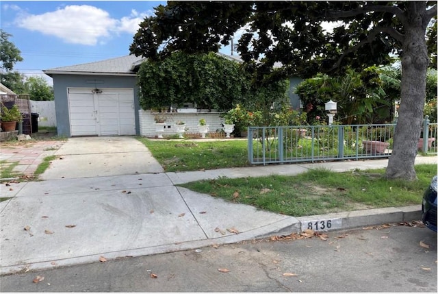 obstructed view of property with a garage