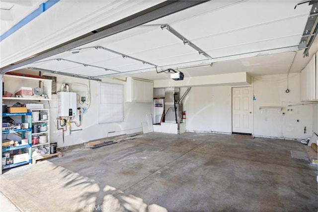 garage with a garage door opener and water heater