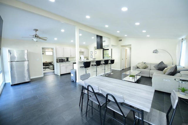 9452 Larrabee Ave, San Diego, CA 92123 - dining space with a ceiling fan, visible vents, baseboards, vaulted ceiling, and recessed lighting