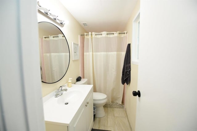 9452 Larrabee Ave, San Diego, CA 92123 - bathroom featuring curtained shower, vanity, toilet, and visible vents