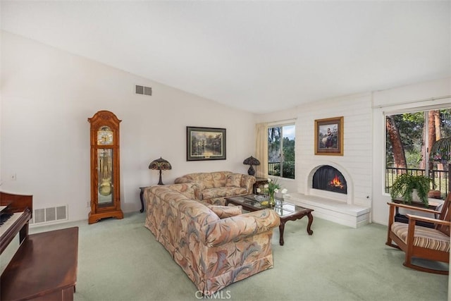 living room featuring vaulted ceiling and carpet floors