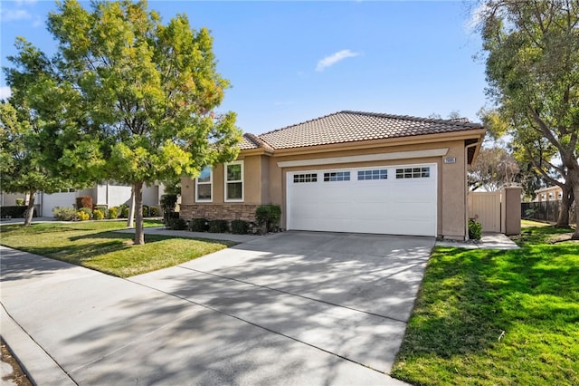 view of front of house with a garage and a front yard