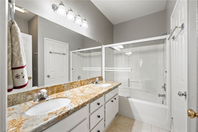 bathroom with tile patterned flooring, shower / bath combination, and vanity