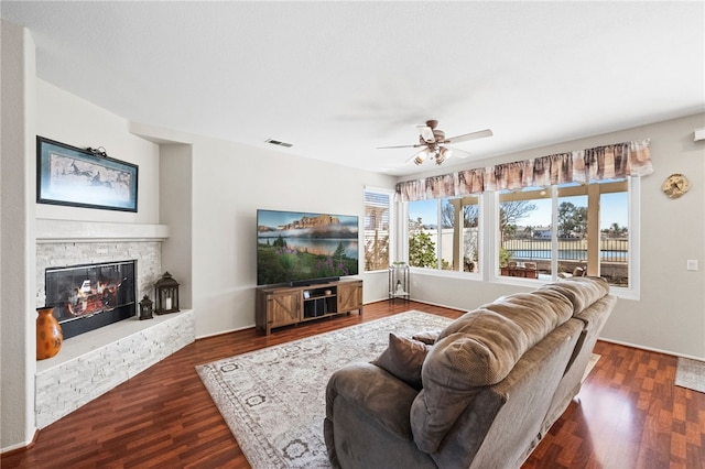 living room with dark hardwood / wood-style floors and ceiling fan