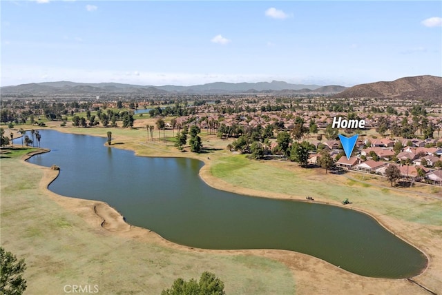 birds eye view of property featuring a water and mountain view