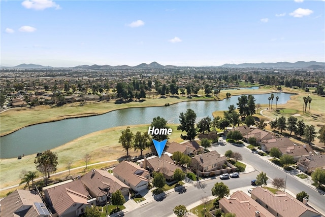 aerial view featuring a water and mountain view