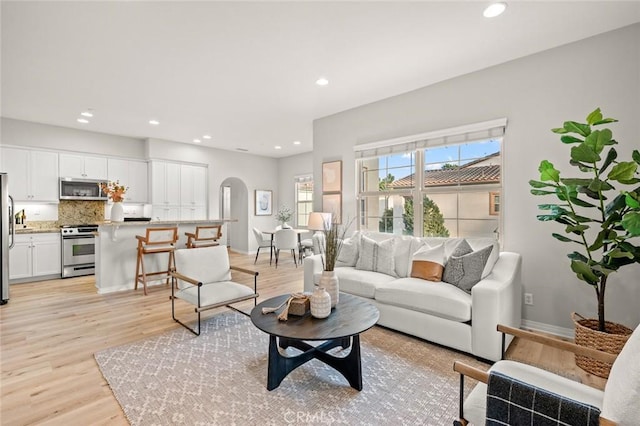 living room with light hardwood / wood-style flooring