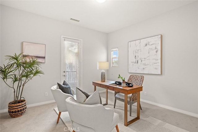 office space with light colored carpet