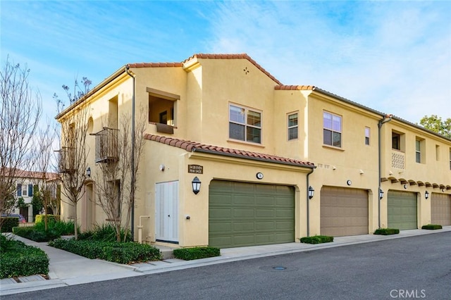 mediterranean / spanish house featuring a garage