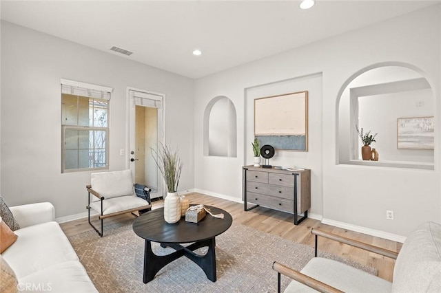 living room with light hardwood / wood-style flooring