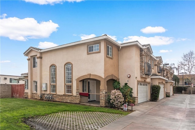 view of front of house with a garage and a front lawn