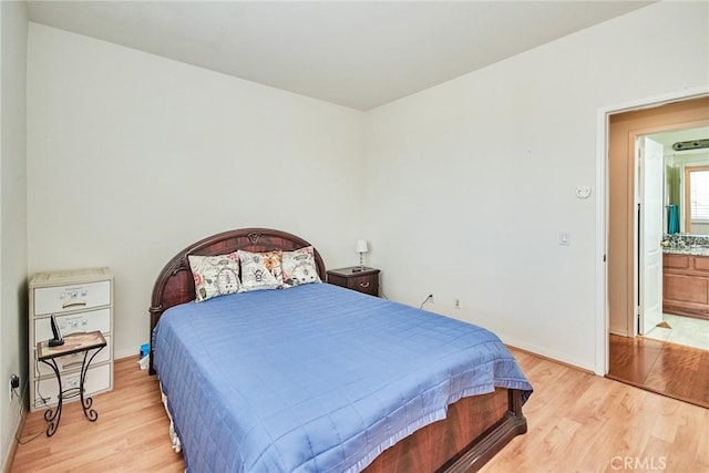 bedroom with light hardwood / wood-style floors