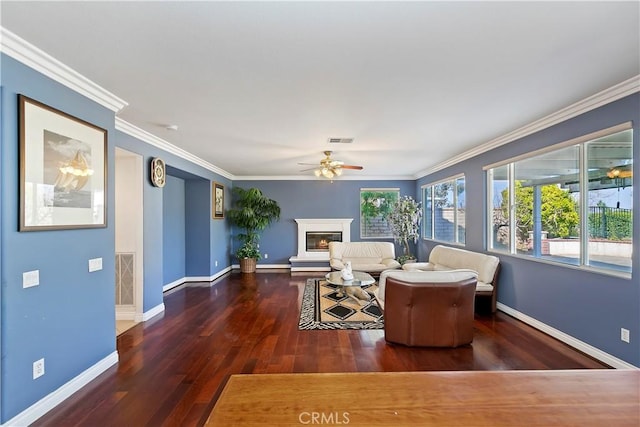 living room with ceiling fan, ornamental molding, dark hardwood / wood-style floors, and a baseboard radiator