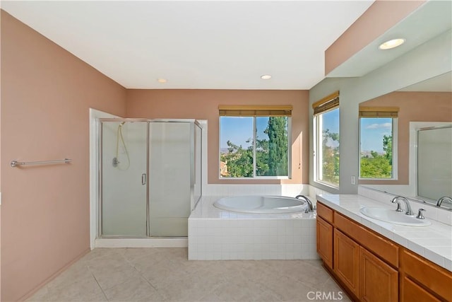 bathroom featuring tile patterned floors, vanity, and independent shower and bath