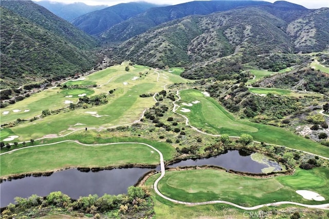 aerial view featuring a water and mountain view