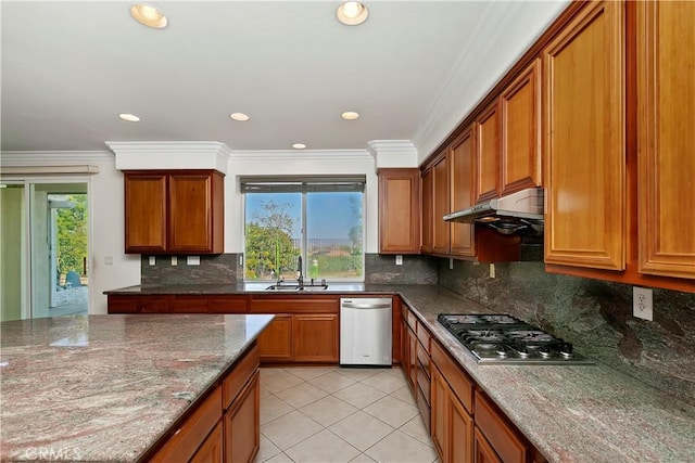 kitchen featuring sink, light tile patterned floors, dark stone countertops, stainless steel appliances, and ornamental molding