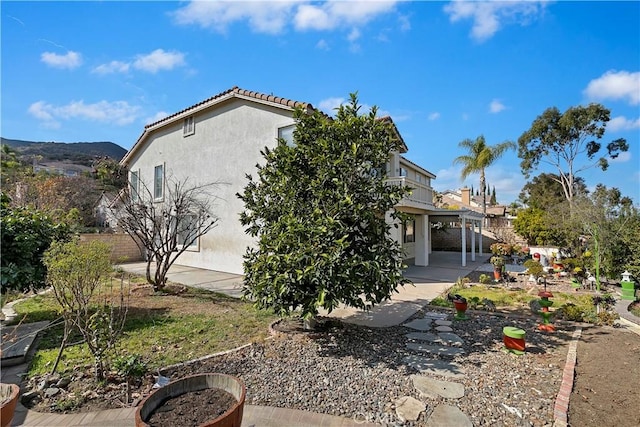 view of property exterior featuring a patio area