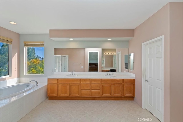 bathroom featuring vanity, tile patterned floors, and independent shower and bath