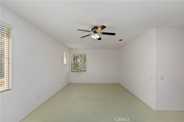 unfurnished room with ceiling fan