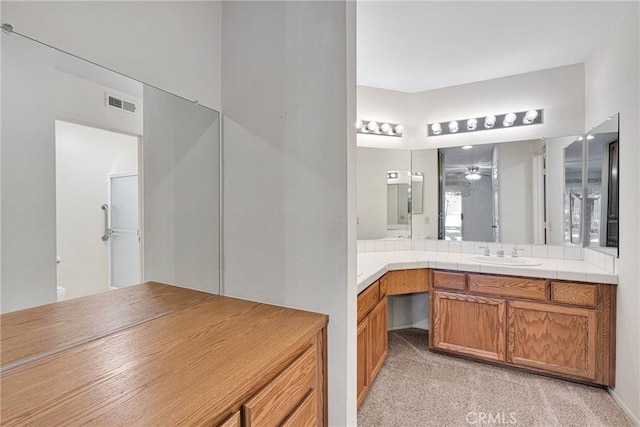 bathroom with vanity and ceiling fan