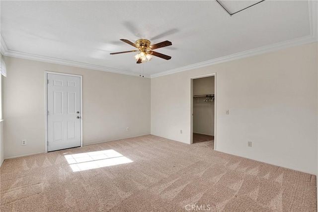 unfurnished bedroom featuring ceiling fan, ornamental molding, and light carpet