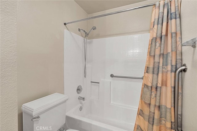 bathroom with shower / tub combo with curtain and toilet