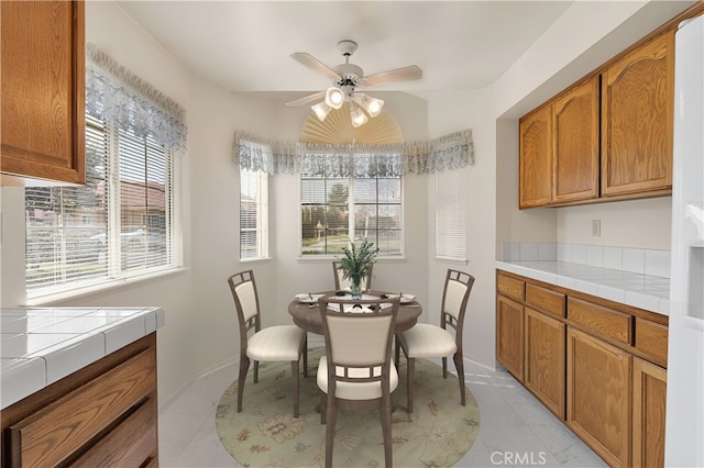 dining room featuring ceiling fan