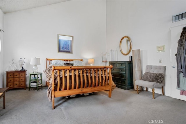 bedroom featuring carpet floors and visible vents