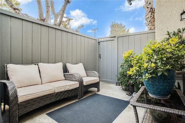 view of patio / terrace with a fenced backyard and an outdoor living space