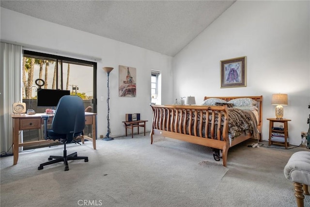 carpeted bedroom with high vaulted ceiling and a textured ceiling