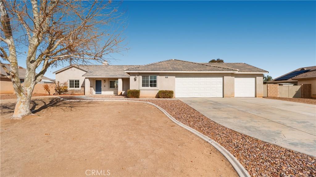 ranch-style house featuring a garage