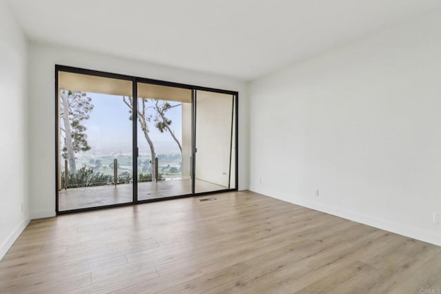 empty room with light wood-type flooring