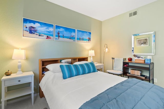 bedroom with carpet floors and visible vents