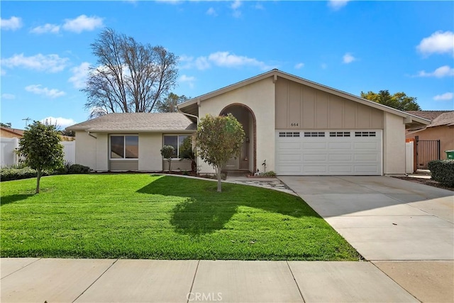 ranch-style home featuring a garage and a front yard