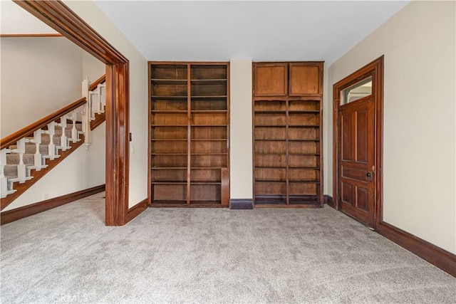 interior space featuring light colored carpet