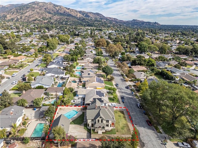 birds eye view of property featuring a mountain view