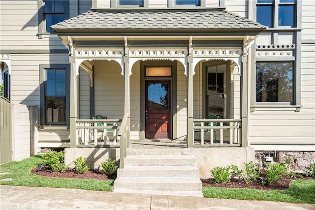 entrance to property featuring a porch