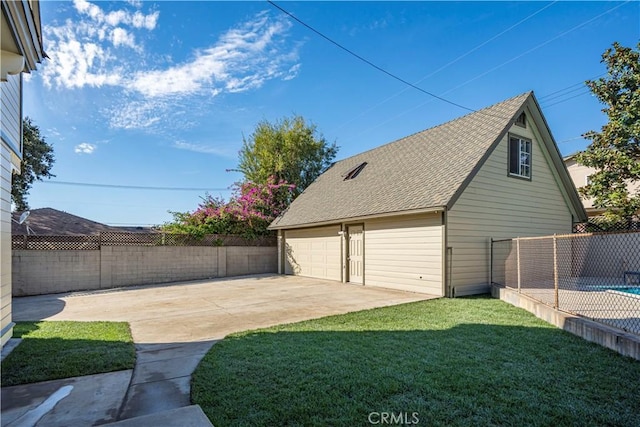 garage with a lawn