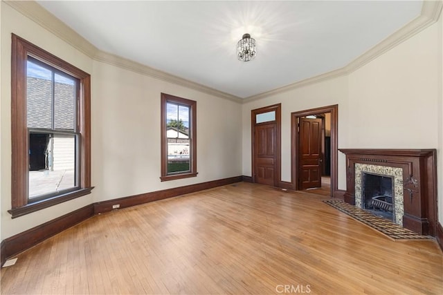 unfurnished living room with hardwood / wood-style flooring and ornamental molding