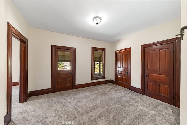 unfurnished bedroom featuring light colored carpet