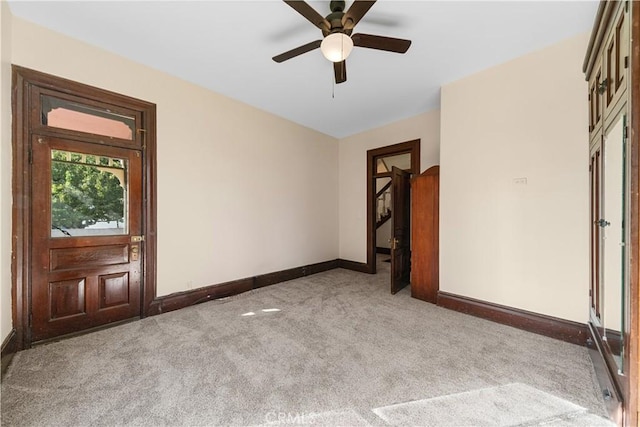 carpeted empty room with ceiling fan