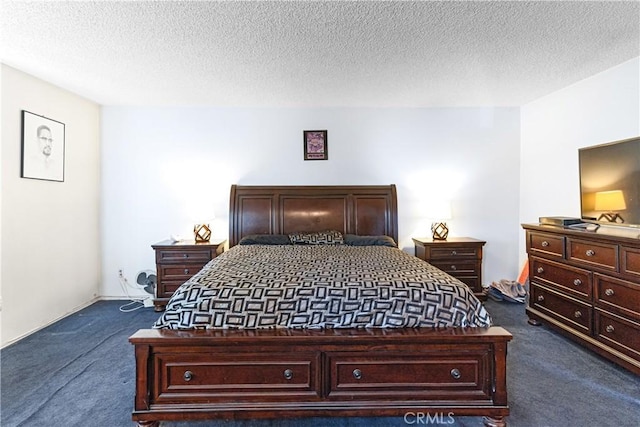 carpeted bedroom featuring a textured ceiling