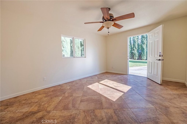 spare room with ceiling fan