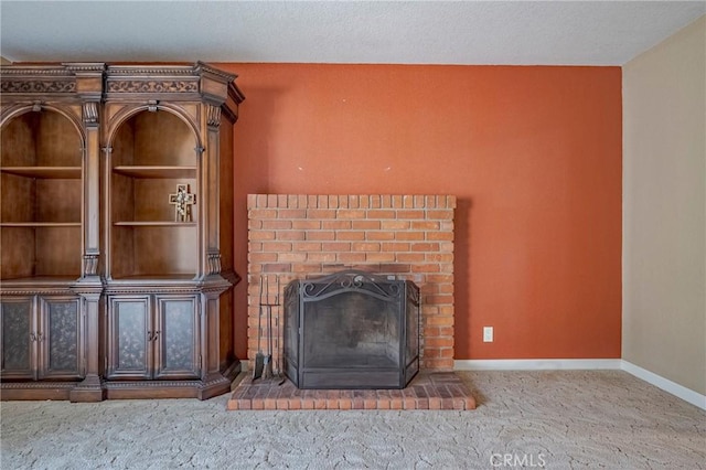 unfurnished living room featuring a fireplace and carpet floors