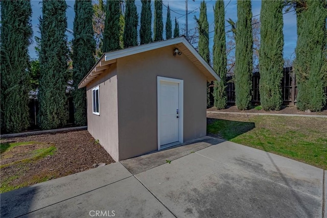 view of outbuilding featuring a yard