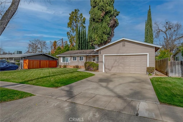 ranch-style home with a garage and a front lawn