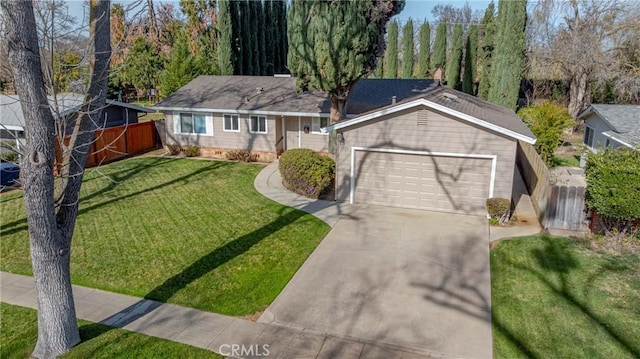 ranch-style home featuring a garage and a front lawn