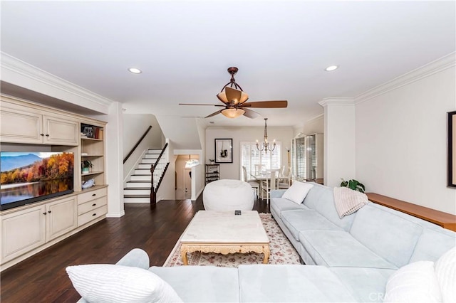 living room featuring crown molding, dark hardwood / wood-style floors, and ceiling fan with notable chandelier