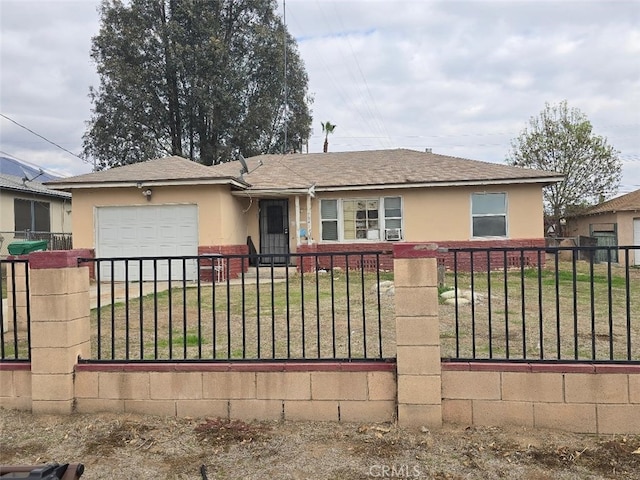 single story home featuring a garage and a front yard