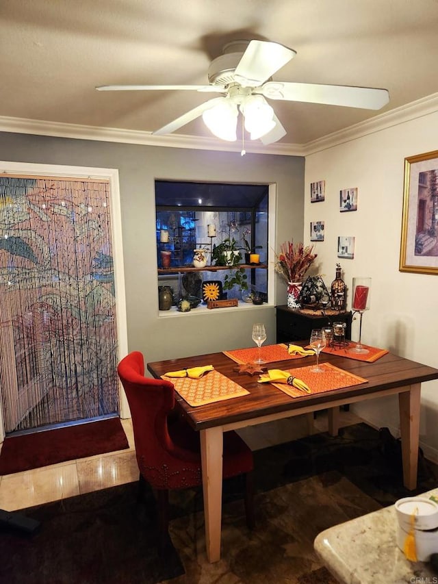 dining space featuring a ceiling fan, ornamental molding, and wood finished floors